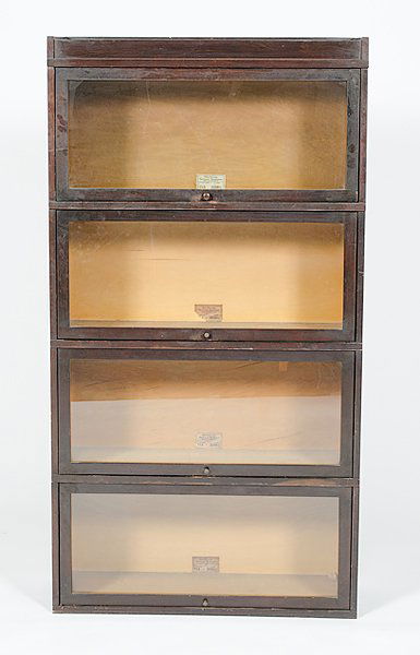Globe Wernicke Stack Bookcase : Globe Wernicke Stack Bookcase American, 20th century, a four stack barrister's bookcase, each stack with lift-up glass doors, labeled Globe Wernicke Co. / Sectional Bookcase / Cincinnati OH; ht. 63,