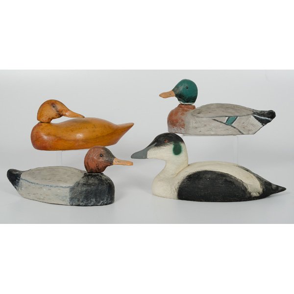 Duck Decoys : Duck Decoys American, a group of four duck decoys, two being of paper mache with wood heads, two carved and painted wood, all unmarked; largest ht. 7, wd. 17 in.