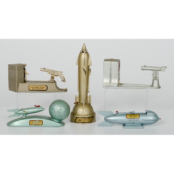 Lot of Five White Metal Mechanical Banks : Lot of Five White Metal Mechanical Banks Includes Atomic Bank, Mercury Rocket Bank, Wild West Bank, Strato Bank, and Satellite Bank. Largest 10.5 in h.