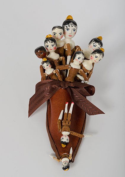 Fred T. Laughon Carved Old Woman In Shoe : Fred T. Laughon Carved Old Woman In Shoe America, 20th century, a brown Renaissance style leather shoe filled with ten carved wooden jointed dolls, depicting "Old Woman In The Shoe"; signed,F.T.L./9