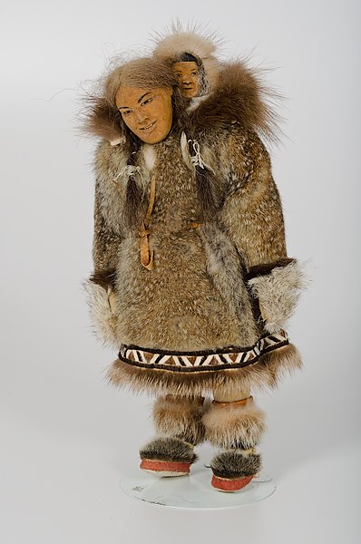 Dolly Spencer Eskimo Assouk Doll : Dolly Spencer Eskimo Assouk Doll Alaska, mid 20th century, a Assouk with baby Eskimo doll having carved birch wood face, sealskin parka, all caribou sinew sewn, clothing authentic as would be made b
