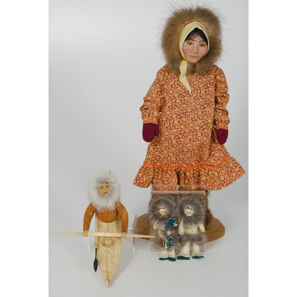 Steven Tegoesak Eskimo Doll in Canoe, Plus : Steven Tegoesak Eskimo Doll in Canoe, Plus Alaska, mid 20th century, a Eskimo doll made of leather with painted face, wearing a brown buckskin fur, in a caribou canoe with wood harpoon; lg. 11.5 in.