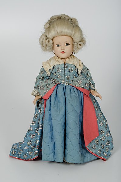 Effanbee 1750 Character Doll : Effanbee 1750 Character Doll American, 20th century, a composition 1750 character doll, with blue glass eyes, white wig in high style, blue cottom print gowin with coral lining and quilted under dre
