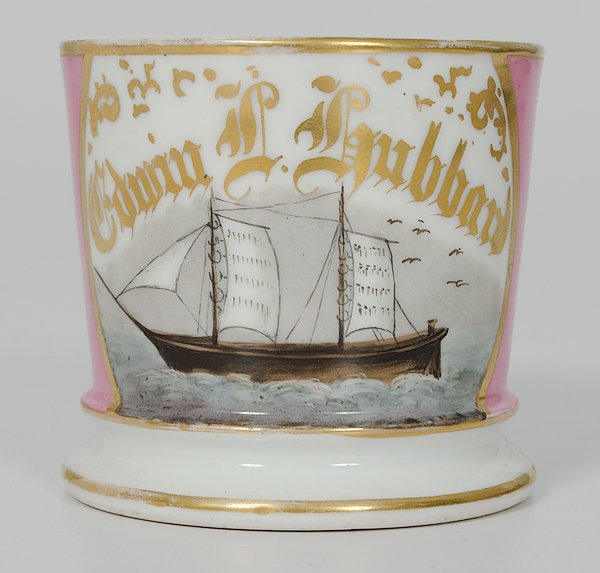 Sailing Ship Shaving Mug : Sailing Ship Shaving Mug Porcelain with polychrome painted scene of a sailing vessel. With pink monochrome wrap and gilt name Edwin L. Hubbard. Ht. 3.25".