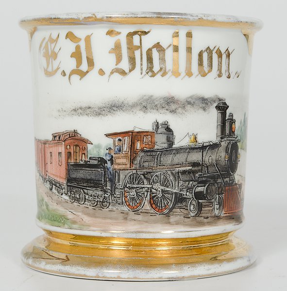 Train Engineer's Occupational Shaving Mug : Train Engineer's Occupational Shaving Mug Porcelain with polychrome painted scene of a moving locomotive passing through the countryside, with conductor and engineer on board. Gilt name E.J. Fallon.