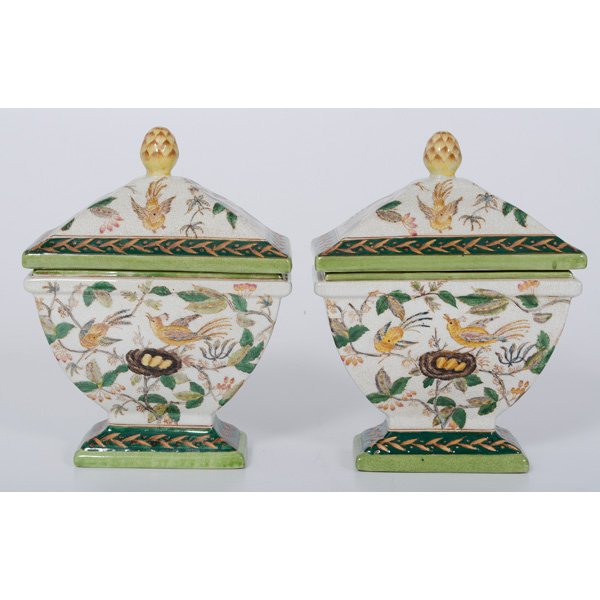Ironstone Urns with Bird Motifs : Ironstone Urns with Bird Motifs 20th century. A pair of faceted ironstone lidded urns, each with a pinecone finial, having painted bird and fauna decoration on a white ground, illegible mark on bott