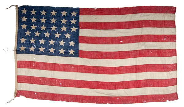 35-Star American Flag, Signed Dr. L.B. Putnam 1866 : 35-Star American Flag, Signed Dr. L.B. Putnam 1866 Wool bunting, 72.5 x 115 in., with 35 hand-sewn, single-applique cotton stars configured in 6/6/6/5/6/6 horizontal rows. The fly is constructed of 