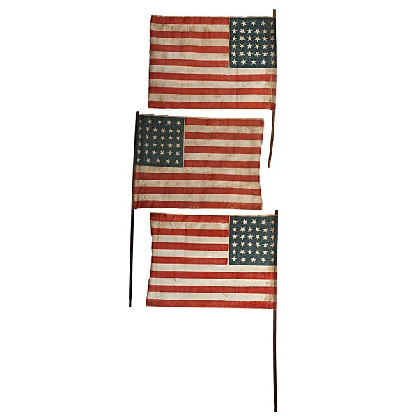 Group of 34-Star American Parade Flags : Group of 34-Star American Parade Flags Lot of 3 glazed cotton, printed parade flags, each with 34 stars configured in 5/6/6/6/6/5 horizontal rows, 7.75 x 10.75 in., each mounted on wooden dowel. Kan