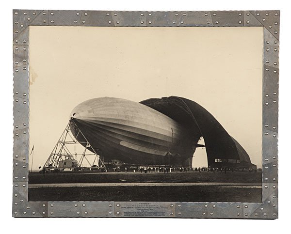 Margaret Bourke-White Photograph of the USS Akron: Margaret Bourke-White Photograph of the U.S.S. Akron Silver gelatin photograph signed lower right Bourke-White, documenting the maiden launch of this airship from the air dock in Akron, OH, 17 x 23 