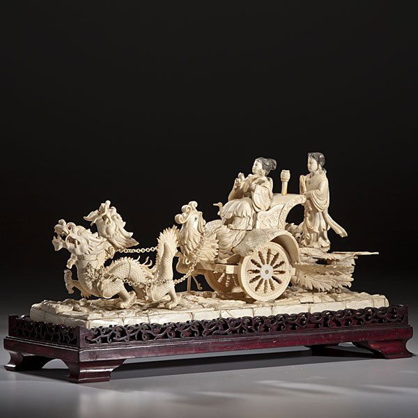 Chinese Carved and Inked Ivory Figural Group : Chinese Carved and Inked Ivory Figural Group Chinese. A large carved and inked ivory figural group depicting a female riding in a carriage atop a phoenix, the cart is being pulled by two four-cla