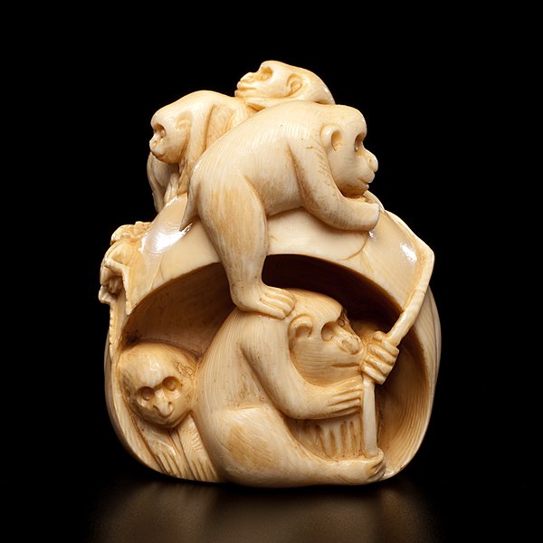 Japanese Ivory Monkey Netsuke : Japanese Ivory Monkey Netsuke Japanese, early 20th century. A large ivory netsuke carved to depict six monkeys and a cricket on a boulder, with a two-character mark scratched on the bottom;