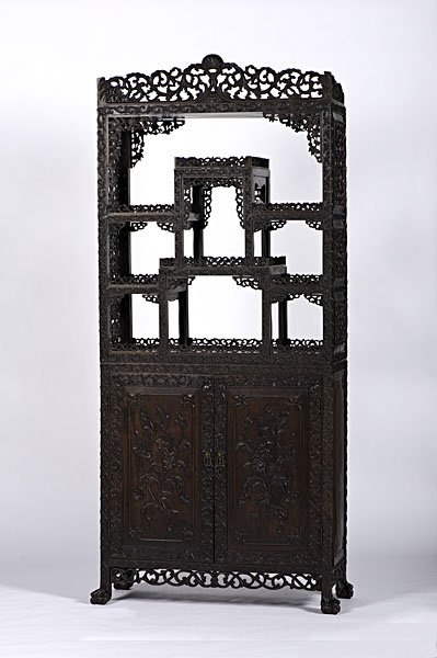 Chinese Export China Cabinet : Chinese Export China Cabinet Chinese Export, 19th century. An ornately carved rosewood china cabinet with pierced and carved scrolling cornice centered by a carved shell above open upper shelves hav