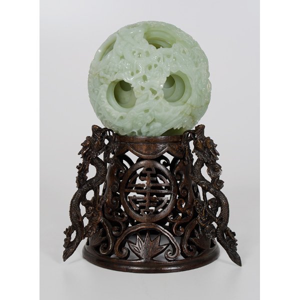 Chinese Hardstone Puzzle Ball : Chinese Hardstone Puzzle Ball Chinese. A hardstone puzzle ball on ornately carved wooden stand with dragon motifs and shou symbols in reserves, unmarked; ball dia. 3.75 in. Provenance: Ex 