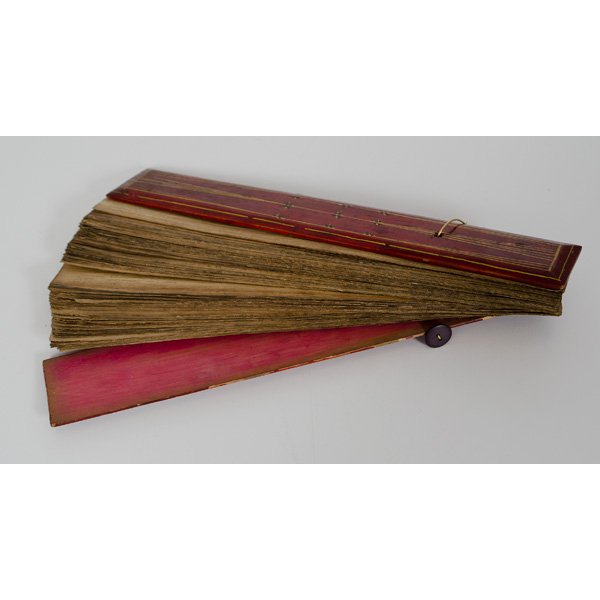 Thai Buddhist Sutra Leaves : Thai Buddhist Sutra Leaves Thai, ca 19th century. A large group of Buddhist sutra leaves enclosed within two lacquered boards, all tied together with elastic chord; lg. 14.5 in. Provenance: 