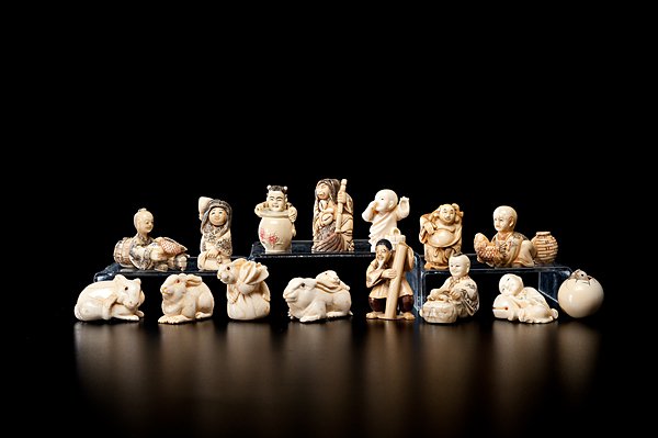 Japanese Netsukes : Japanese Netsukes Japanese, 20th century. An assembled group of six ivory netsukes, seven bone netsukes, and two resin netsukes, thirteen signed; largest ht. 2.25 in. International shipping is no