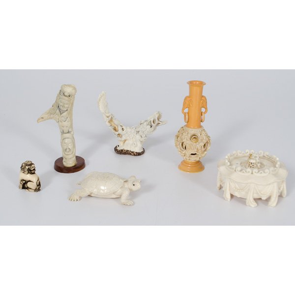 Ivory, Bone, and Resin Items : Ivory, Bone, and Resin Items 20th century. An assembled group of ivory, bone, and resin items including an ivory top, a bone turtle, a French ivory puzzle ball, a resin totem pole, a carved bone ani