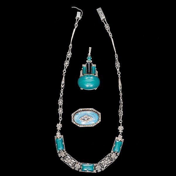 Marcastie Pendant, Necklace and brooch : Marcastie Pendant, Necklace and brooch A grouping of Marcasite jewelry composed of a pendant, a brooch and a necklace; all signed pieces are stamped.