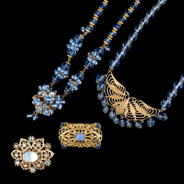 Miriam Haskell and Unsigned Set : Miriam Haskell and Unsigned Set A grouping of Miriam Haskell and Unsigned jewelry composed of two necklaces and two brooches; all signed pieces are stamped.