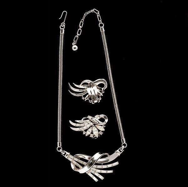 Trifari Necklace and Ear Clip set : Trifari Necklace and Ear Clip set A grouping of Trifari composed of a necklace and a pair of ear clips; all signed pieces are stamped.