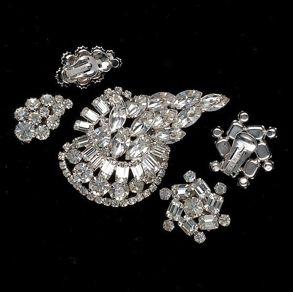 Trifari, Weiss and Unsigned Jewelry : Trifari, Weiss and Unsigned Jewelry A collection of Trifari, Weiss and Unsigned Jewelry composed of two pair of ear clips and a brooch; all signed pieces are stamped.