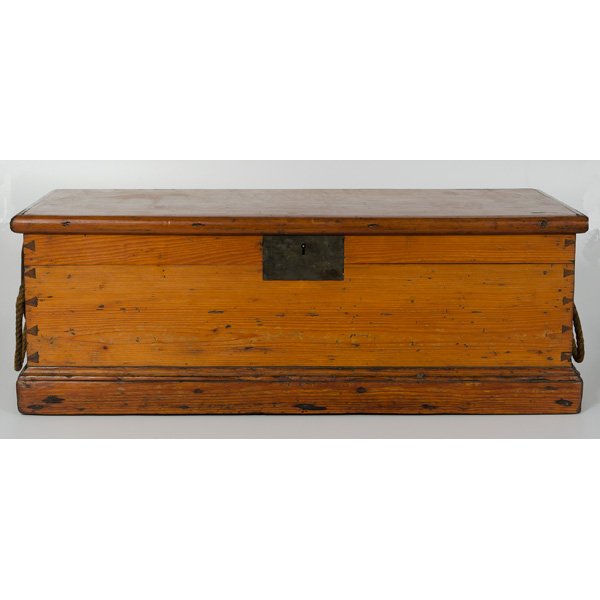 Sailor's Chest : Continental, a sailor's chest in pine having open dovetailed sides, early hardware, rope handles, and with a hinged lid and resting on a plinth base; ht. 12.25, wd. 35.5, dp. 16.5 in.