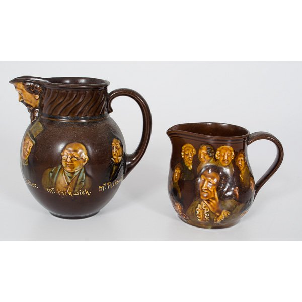 Royal Doulton Dickens Pitchers : English, 20th century. Pair of Royal Doulton Charles Dickens character pitchers, one depicting the characters and titled Sidney Garton, Fagin, Bill Sikes, Sam Weller, Mr. Pickwick and Mr. Peck