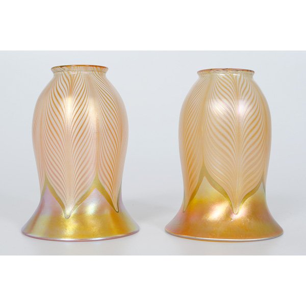 Quezal Pull Feather Glass Shades : American, a pair of gold aurene glass shades with pulled feather design, marked Quezal; ht. 6.5 in.