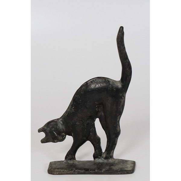 Early Folk Art Black Cat Cast Iron Doorstop : American, an early painted black cat doorstop, marked "Sculptured Metal Studios", dated 1928. Ht. 13, lg. 9 in.