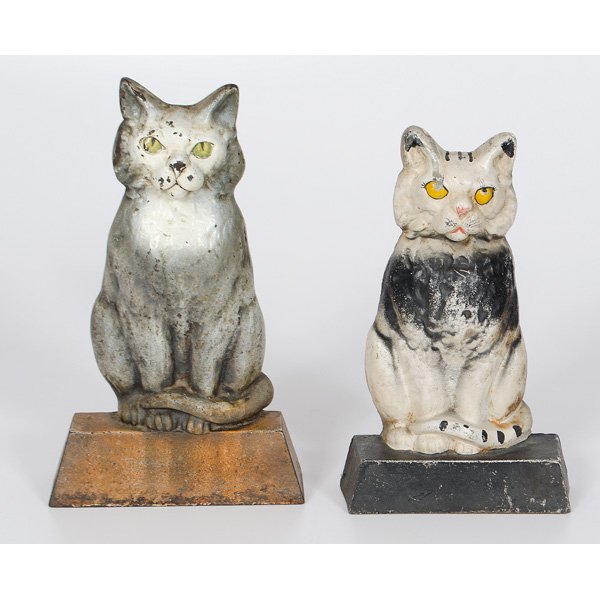 Cast Iron Painted Cat Doorstops : American, two painted cast iron cat doorstops with glass eyes, unmarked; largest ht. 13 in.