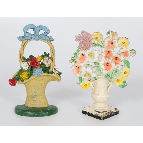 Cast Iron Flower Basket Doorstops : American, two cast iron and painted flower basket doorstops, one marked 69 and "R", the other a bouquet of gladiolas in a vase by Hubley, marked 489; ht. 10 in.