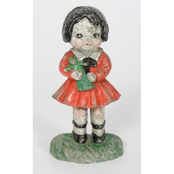 Little Orphan Annie White Metal Doorstop : American, a painted white metal Orphan Annie doorstop, unmarked; ht. 9 in.