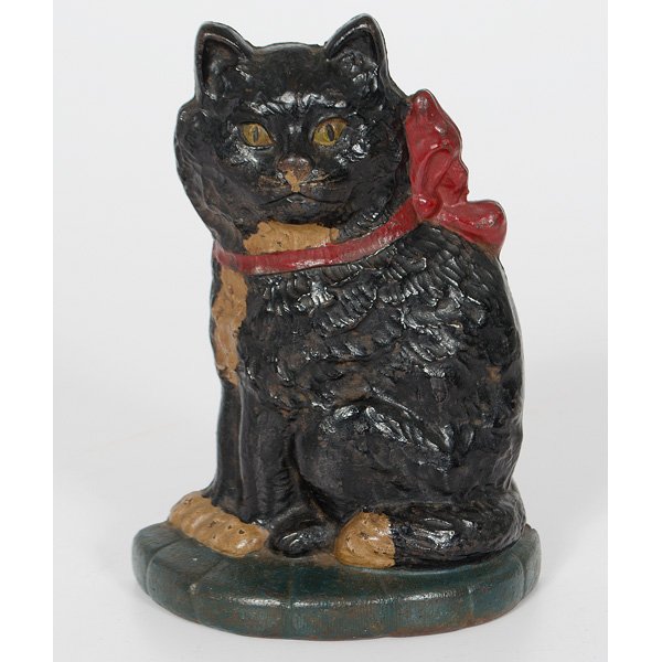 Sitting Cat Cast Iron Doorstop : American, painted cast iron sitting cat on pillow doorstop, Marked "COPR 1929" with Connecticut Foundry mark and 'ANGC RA CAT" ht. 12.5 in.
