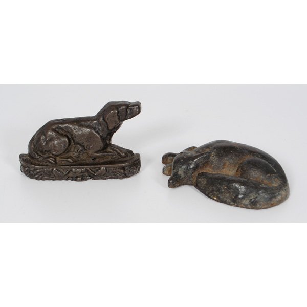 Cast Iron Dog and Fox Doorstops : American, a painted cast iron reclining dog, possibly a bookend. ht. 3.75 in; Plus a painted cast iron lying fox; lg. 3.5 in.