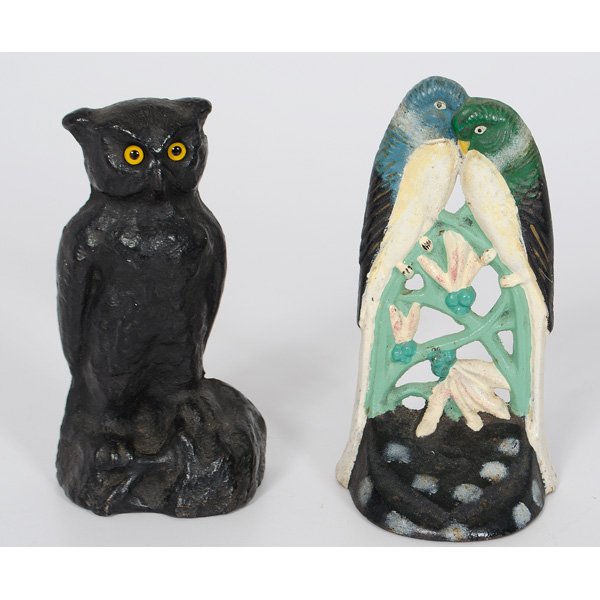 Love Birds And Owl Cast Iron Doorstops : American, a cast iron painted love birds doorstop, unmarked; ht. 7 in; Plus a painted cast iron Owl doorstop with glass eyes; ht. 6.75 in.
