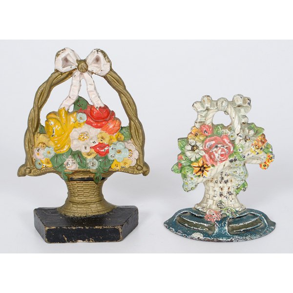 Cast Iron Basket Doorstops : American, two cast iron flower baskets doorstops, original paint, one marked Arthur Mfg, the other unmarked; tallest ht. 8.5 in.