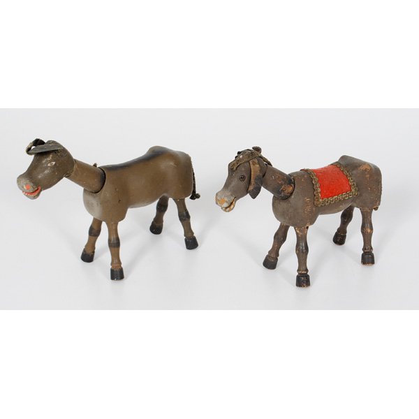 Schoenhut Donkey and Cow : A painted wooden cow with painted eyes and rope tail; ht; 7, lg 10 in, PLUS painted wood donkey with glass eyes, rope tail and leather ears ht. 7, lg. 10 in.