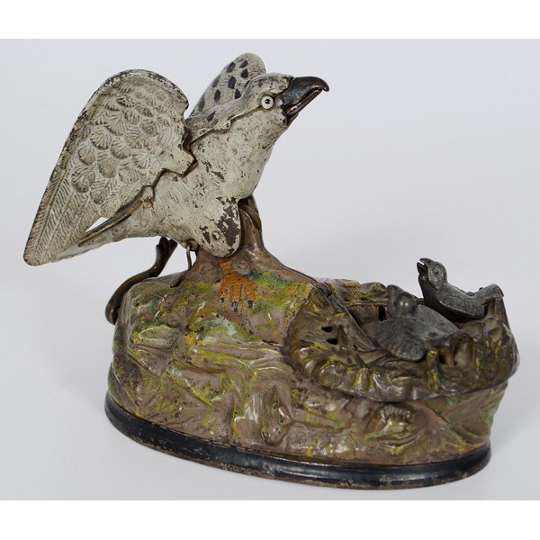 Cast Iron Eagle On Nest Mechanical Bank : Rare cast iron mechanical bank of a eagle nest with mother and young, original paint, in working order; ht. 6.5, lg 7 in.
