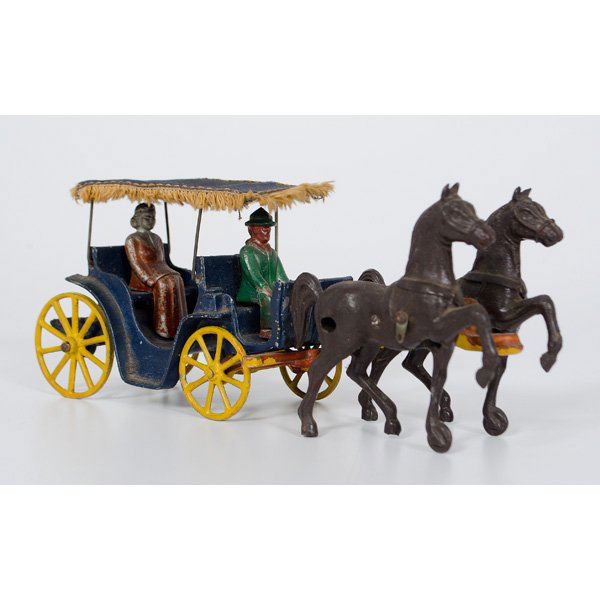 Stanley Toys Cast Iron Toy Horse Drawn Buggy : A cast iron horse drawn buggy with seated figurines, all original. Marked Stanley Toys Made In USA on underside of buggy and carriage frame; ht. 4.25, lg 11.5 in.