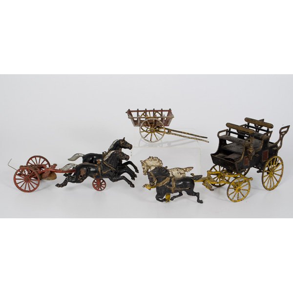 Cast Iron Horse Drawn Wagon, Plus : Cast Iron horse drawn wagon with original paint, unmarked; ht. 7. lg 16.5 in. PLUS a cast iron horn pulling a two wheel hitch, and a cast iron pull wagon; largest lg. 13 in.