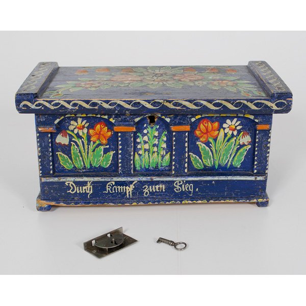 Miniature Painted Chest : German or Austrian, early 20th century. Pine chest in blue paint with floral decoration on lid and within the tripartite divisions of the front face. Dunty Kamph Zuth Sieg painted on lower sectio