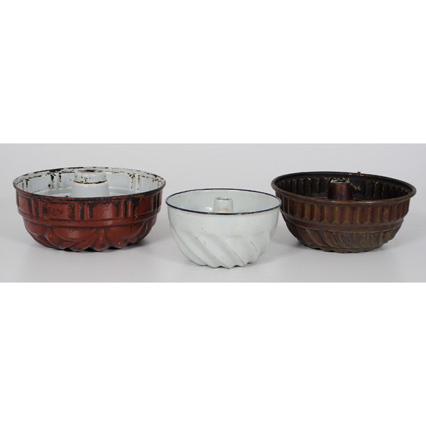 Turk's Head Molds : Probably English, 19th and 20th century. Three 'Turk's Head" molds, one in copper and two in enameled metal, all with ribbed sides; largest, ht. 5 in.
