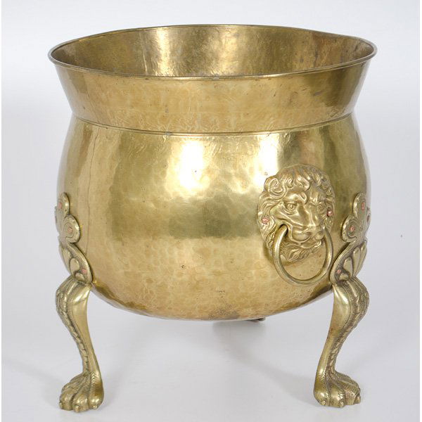 Hammered Coal Hod : 20th century, a hammered brass coal hod raised on three-claw-feet, having two lion-headed handles with decorative copper rivets, unmarked; ht. 14, dia. 13.25 in.