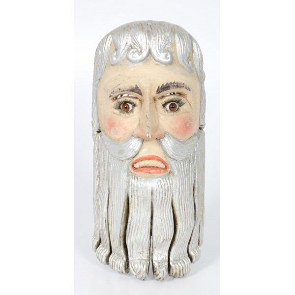 Folk Art Mask of Father Time : Probably Greek or Mexican, a carved and silver painted mask, with eye slits and nose holes, glass eyes and eye lashes. Paper label on back reads, "ST KRONOS / Father Time / Rare Depiction"; ht. 16.5,