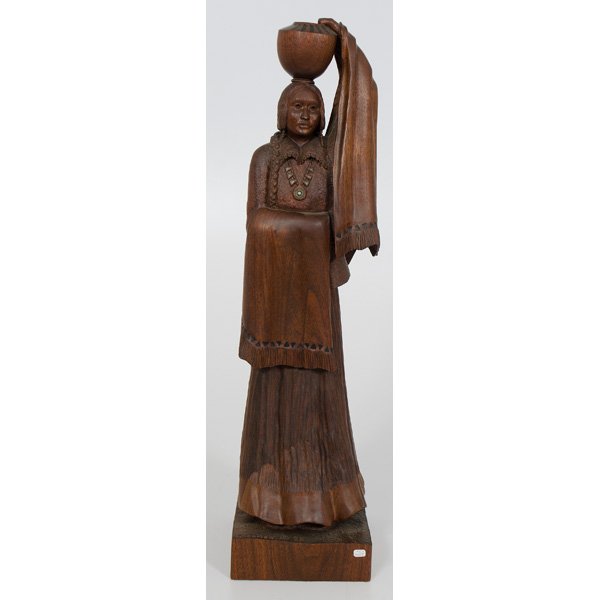 Bob Boomer Black Walnut Wood Carving The Water Car: Black walnut wood carving of a Native American woman carrying a water pot, by Bob Boomer. With Artist's name and 85 carved on base. 24 in. ht.
