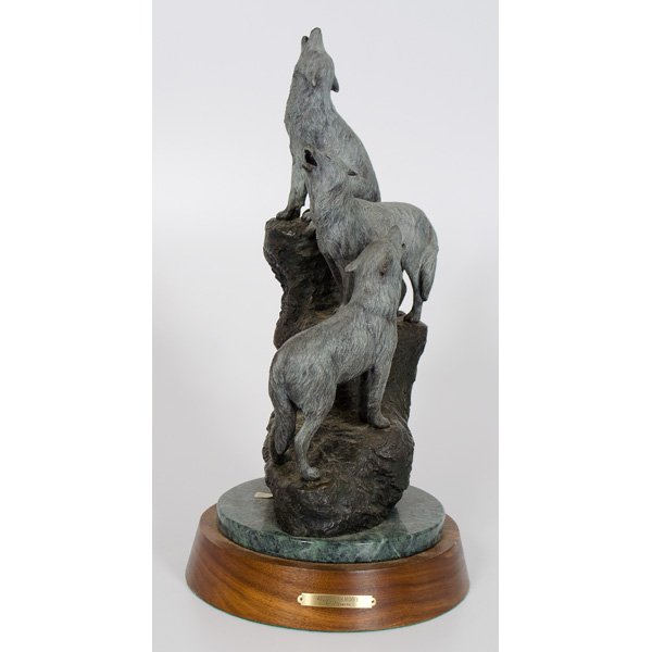 Chris Navarro Bronze Wild Harmony : Bronze depicting three wolves howling in unison. With artist's signature inscribed, dated 90 an numbered 19/24. 19.5 in. height with base, base 10 in. dia.