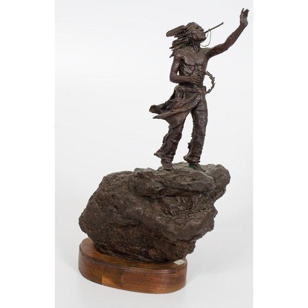 James Roybal Bronze Eagle Bone Whistle : Bronze on wood base depicting a standing Native American blowing a whistle on a rock structure. With title, artist's name, and dated 1978 and numbered 9/20 on right side. 18.5" ht.