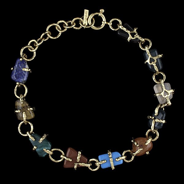 YSL Necklace of Semi-Precious Stones : Yves Saint Laurent gold plated hammered link necklace featuring link-wrapped semi-precious polished lapis lazuli, malachite, turquoise, red jasper, quartz, rhodonite, and coroline stones, with heart d
