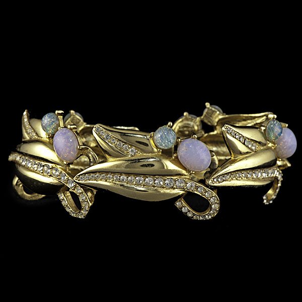 Givenchy Opalescence Bracelet : Ca 1970s-1980s, a segmented stylized leaf bracelet with pave rhinestones and prong set opaque cabochons, marked Givenchy; lg. 6.5 in. Provenance: Property from the Collections of Carole Tanenbaum, 