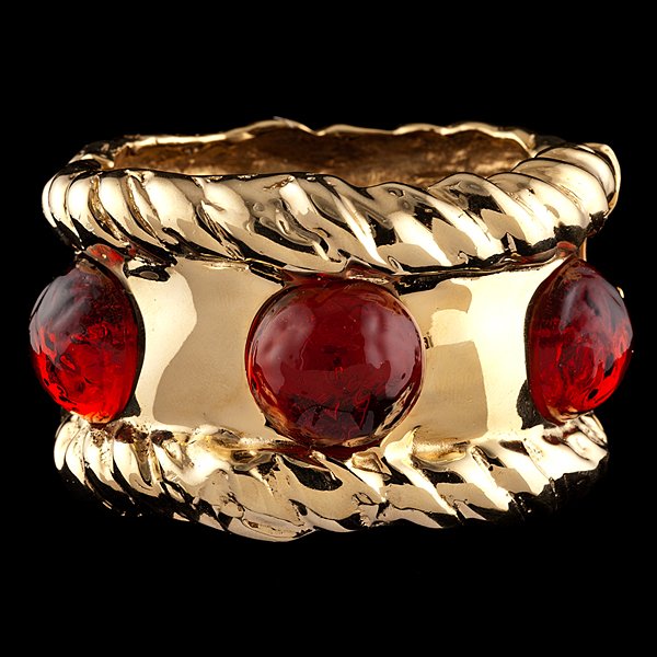 Ciner Hinged Cuff with Cabochons : Polished gold tone hinged cuff bracelet with three poured glass amber cabochons, marked Ciner; inside dia. 2.5 in. Note: CINER Jewelry Company began in 1892 in New York by Emanuel Ciner. The company 