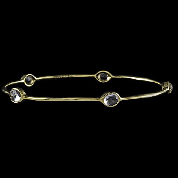 Ippolita 18k Clear Quartz Bangle : Ippolita 18k yellow gold and clear faceted quartz bangle bracelet from the "Rock Candy" collection. Stones are evenly spaced around bracelet and measure 5.53 x 4.78 mm; dia. 2.75 in., wt. 6.3 dwts.